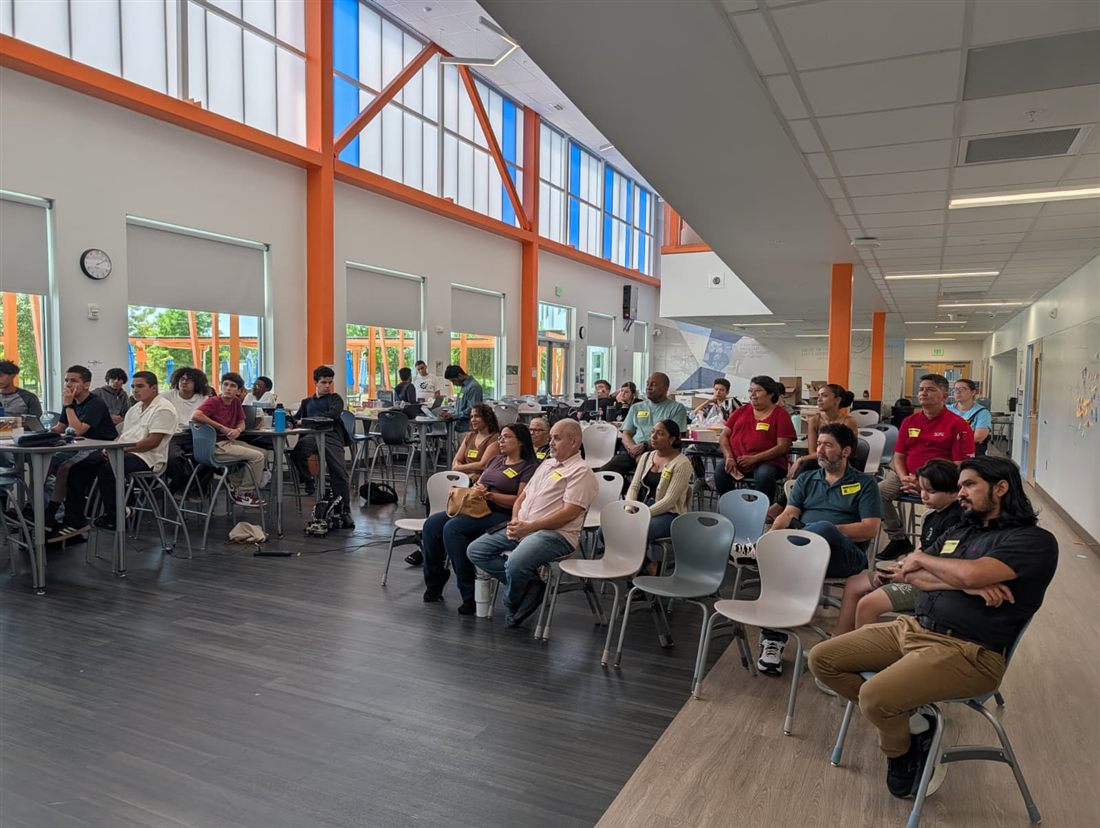 Students and families gather for a session during the Summer Camp.