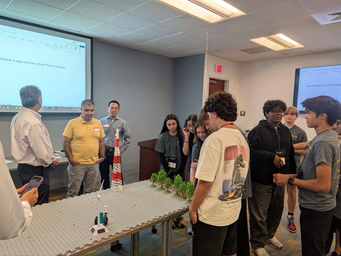 Students and faculty test an AI-guided robot navigating a mock infrastructure-inspection course.