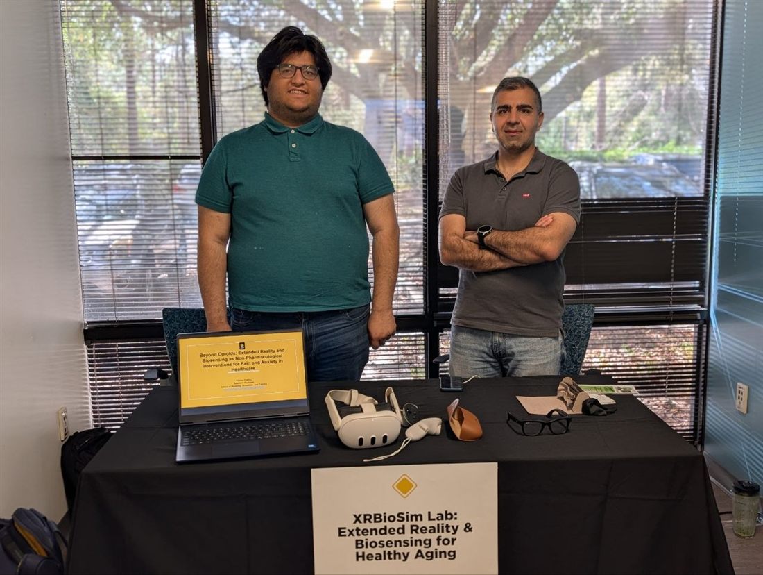 Siddharth Abrol (left) and Sayed Mohammad (Dariush) Sajjadi (right) presenting XR and biosensing demos at the UCF Healthy Aging Fair.